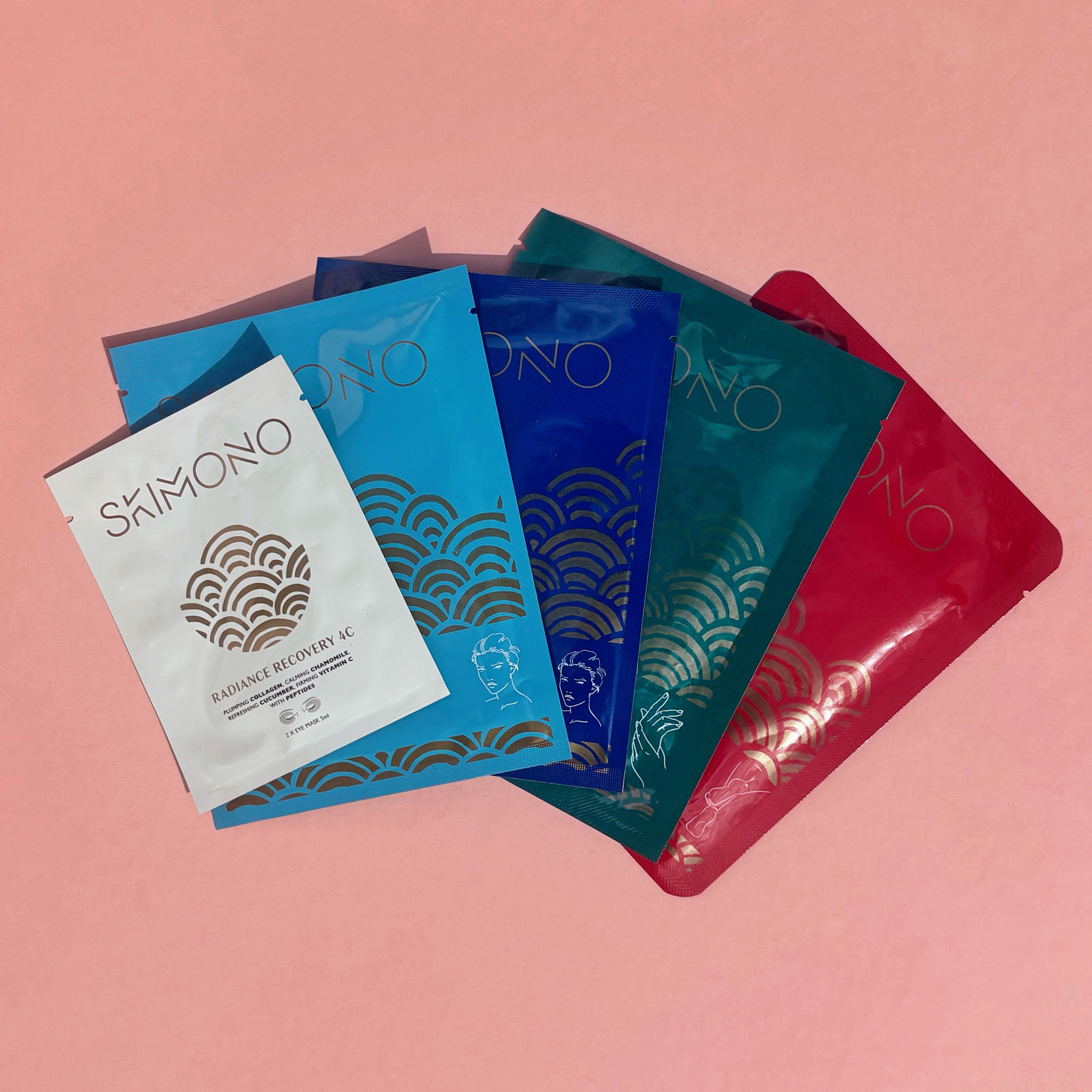 Set of award-winning Skimono sheet masks on a pink background.