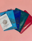 Set of award-winning Skimono sheet masks on a pink background.